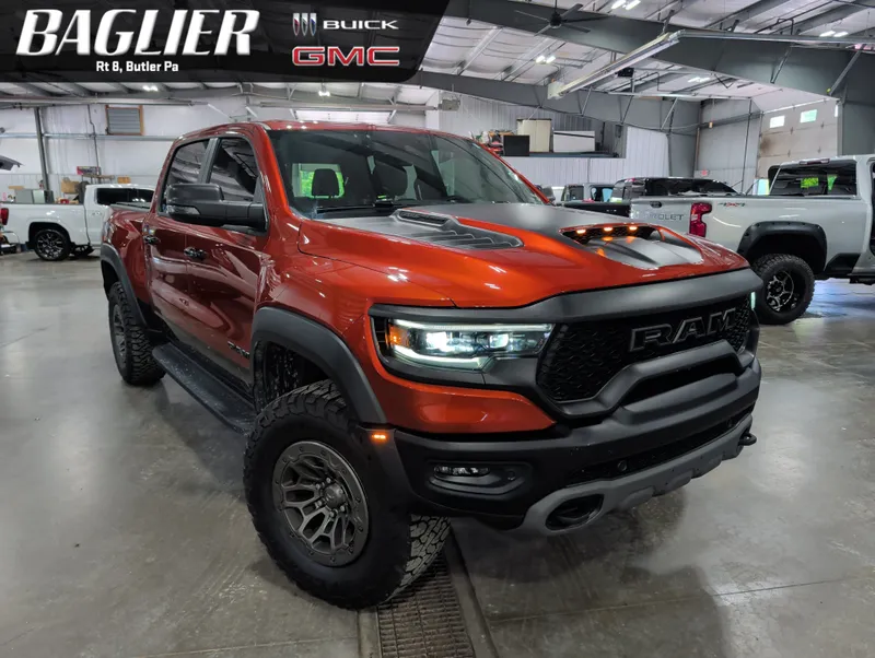 2024 RAM 1500 TRX Crew Cab 4x4 5'7" Box in Orange — front three-quarter view