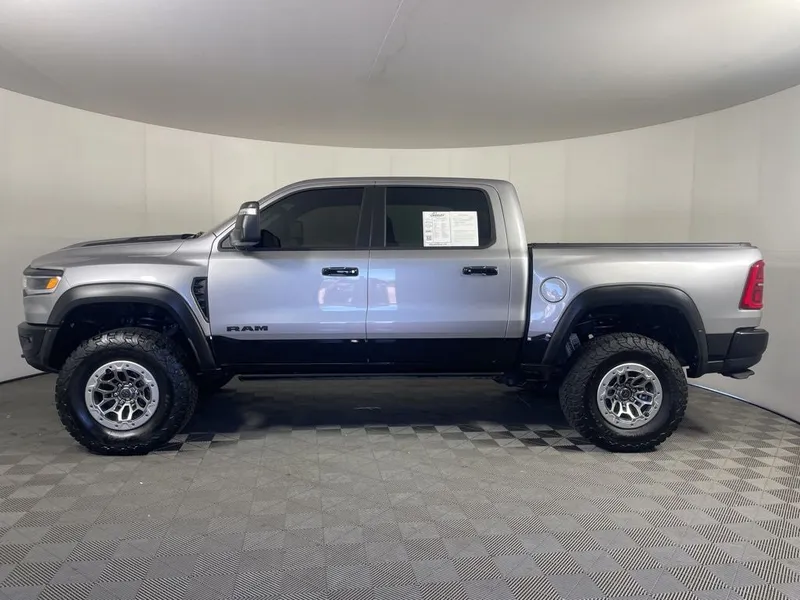 2025 RAM 1500 RHO Crew Cab 4x4 5'7' Box in Billet Silver Metallic Clearcoat — front three-quarter view