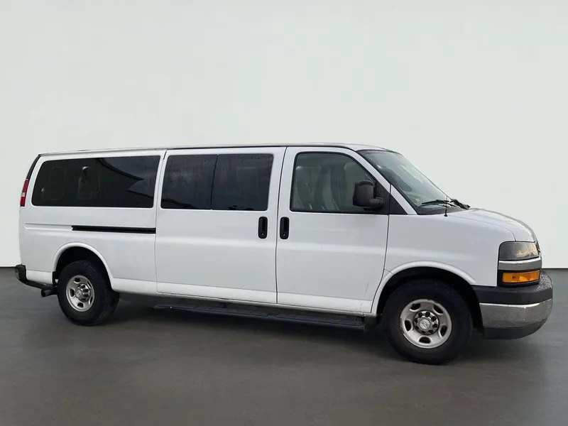 2019 Chevrolet Express Passenger LT in Summit White — front three-quarter view