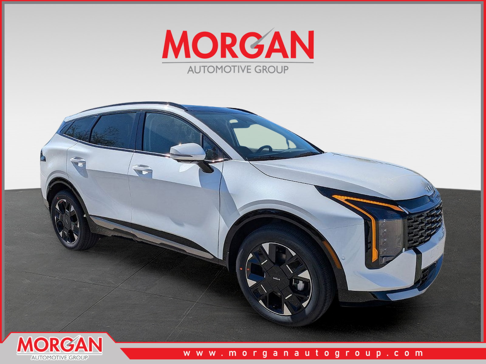 2026 Kia Sportage Hybrid SX-Prestige in Snow White Pearl — front three-quarter view