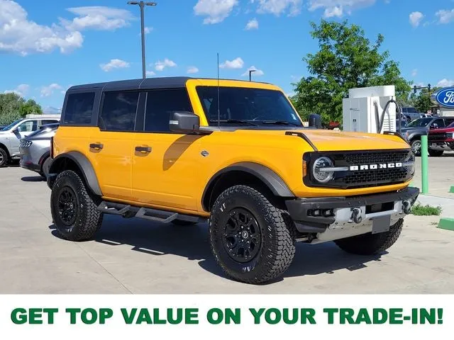 2022 Ford Bronco Wildtrak in Cyber Orange Metallic Tricoat — front three-quarter view