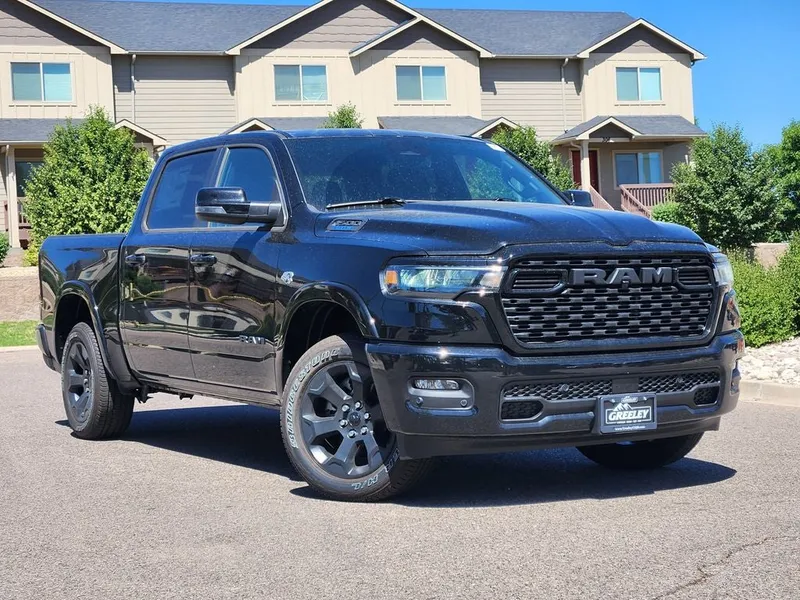 2026 RAM 1500 RAM 1500 BIG HORN CREW CAB 4X4 5'7' BOX in Diamond Black Crystal Pearl-Coat Exterior Paint — front three-quarter view
