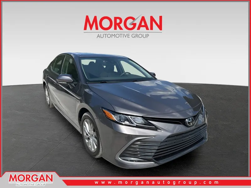 2024 Toyota Camry LE in Predawn Gray Mica — front three-quarter view