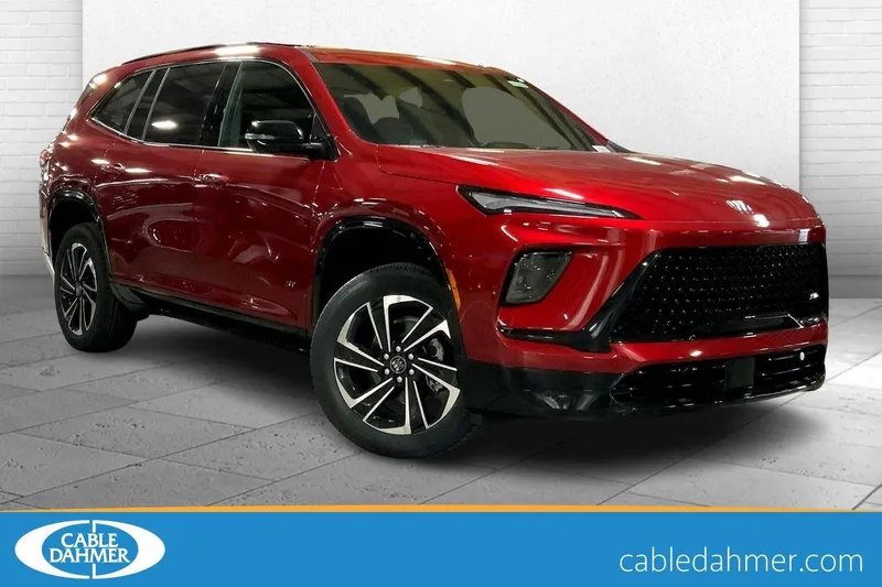 2026 Buick Enclave Sport Touring in Cherry Red Tintcoat — front three-quarter view
