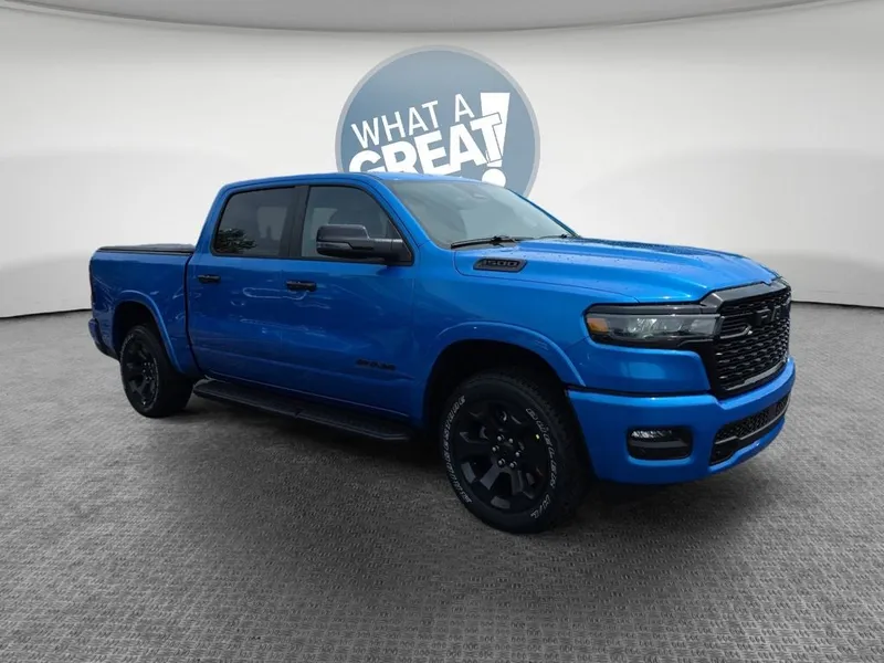 2026 RAM 1500 Big Horn/Lone Star in Hydro Blue Pearlcoat — front three-quarter view