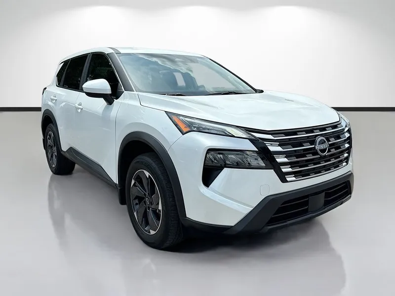 2025 Nissan Rogue SV in White — front three-quarter view