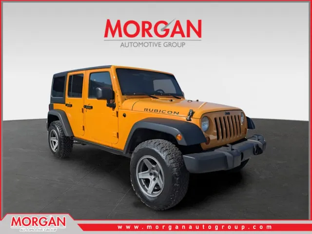 2013 Jeep Wrangler Unlimited Rubicon in Yellow — front three-quarter view