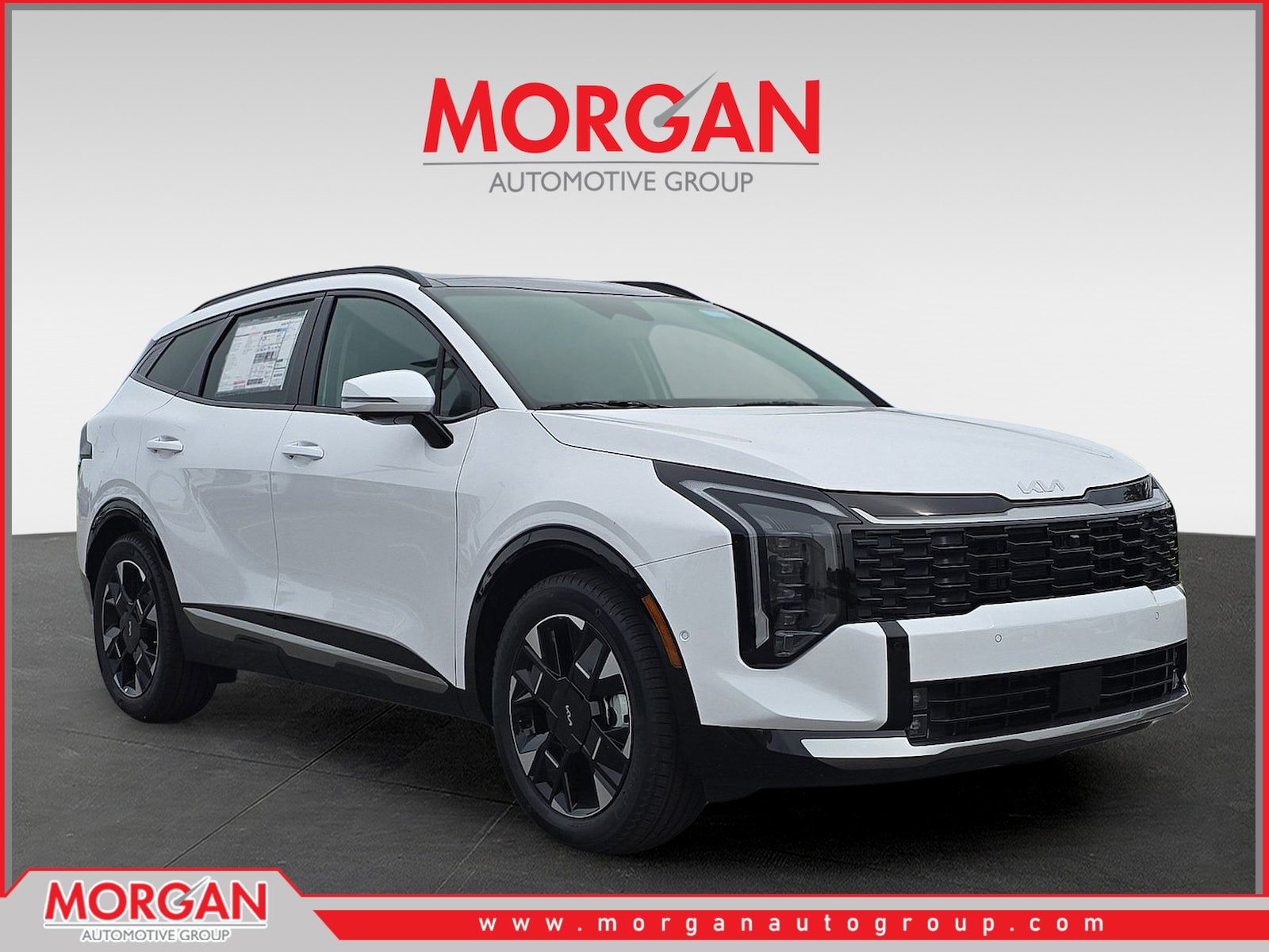 2026 Kia Sportage SX-Prestige in Glacial White Pearl — front three-quarter view