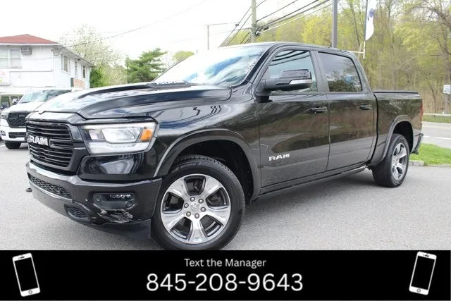 2022 RAM 1500 Laramie in Diamond Black Crystal Pearlcoat — front three-quarter view