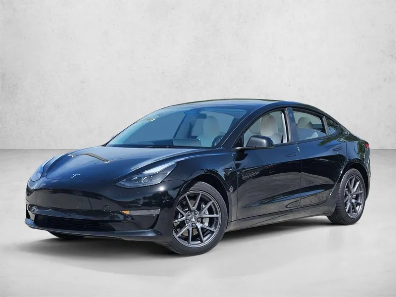2023 Tesla Model 3 RWD in Solid Black — front three-quarter view