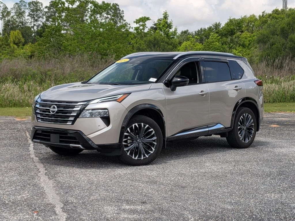 2024 Nissan Rogue Platinum in Gold — front three-quarter view