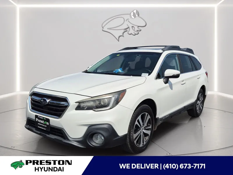 2019 Subaru Outback Limited in Crystal White Pearl — front three-quarter view