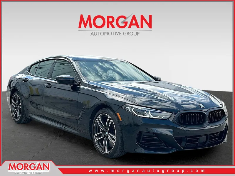 2023 BMW 8 Series 840i in Black Sapphire Metallic — front three-quarter view