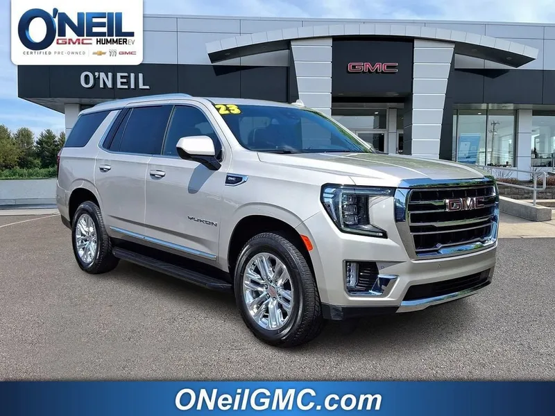 2023 GMC Yukon SLT in Pearl Beige Metallic — front three-quarter view