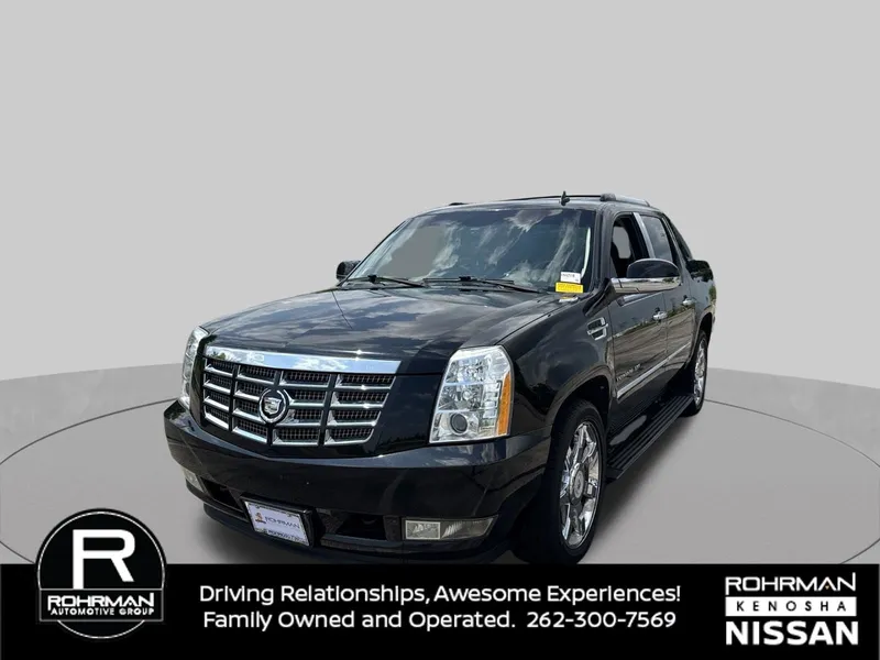 2011 Cadillac Escalade EXT Premium in Black Raven — front three-quarter view