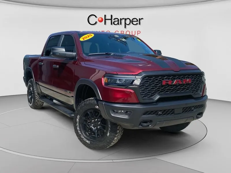 2025 RAM 1500 Rebel Crew Cab 4x4 5'7" Box in Red — front three-quarter view