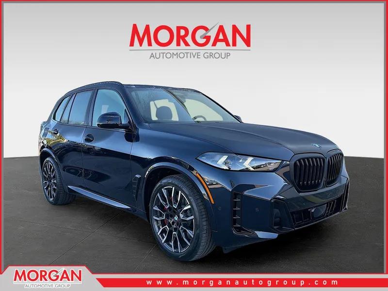2026 BMW X5 xDrive50e in CARBON BLK MET — front three-quarter view