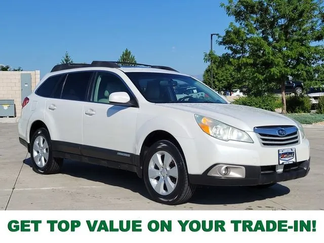 2010 Subaru Outback 2.5i Premium in Satin White Pearl — front three-quarter view