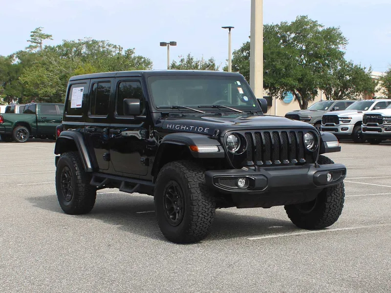 2023 Jeep Wrangler High Tide in Black Clearcoat — front three-quarter view