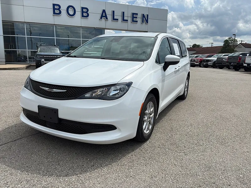 2023 Chrysler Voyager LX in Bright White Clear Coat — front three-quarter view