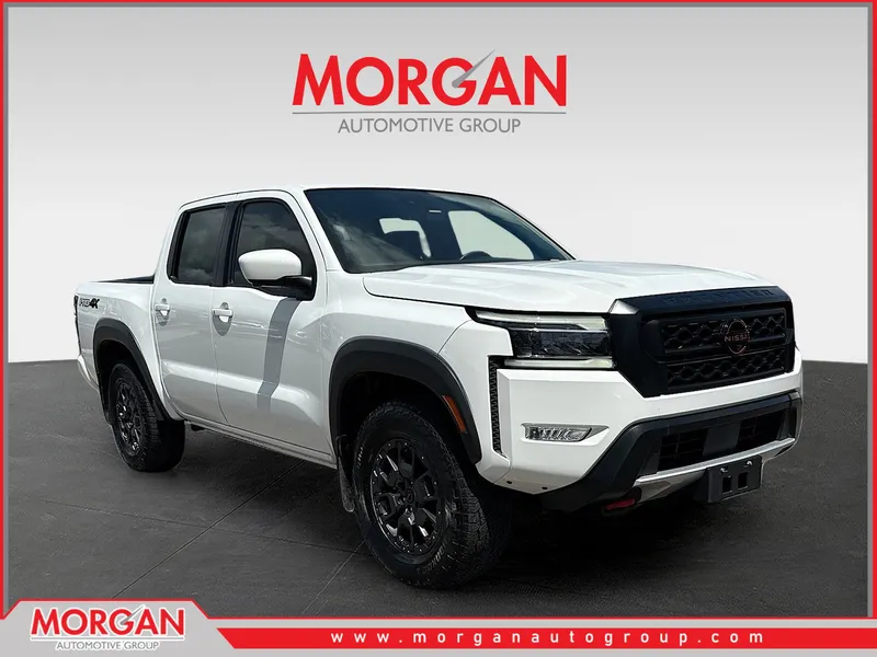 2023 Nissan Frontier PRO-4X in Glacier White — front three-quarter view