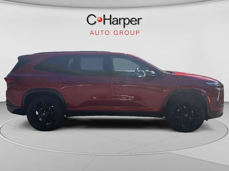 2026 Buick Enclave Sport Touring in Cherry Red Tintcoat — front three-quarter view
