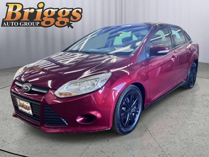 2013 Ford Focus SE in Ruby Red Metallic Tinted Clear Coat — front three-quarter view