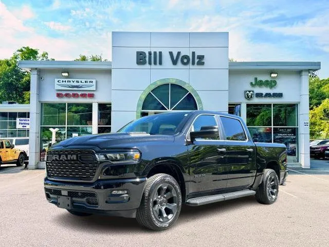 2026 RAM 1500 Express in Diamond Black Crystal Pearl-Coat Exterior Paint — front three-quarter view