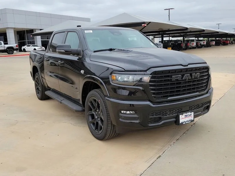 2026 RAM 1500 Laramie in Diamond Black Crystal Pearlcoat — front three-quarter view