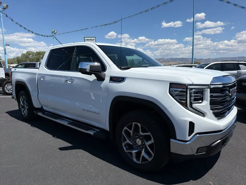 2026 GMC Sierra 1500 SLT in Summit White — front three-quarter view
