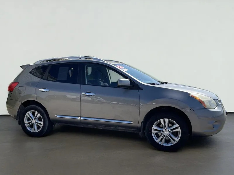 2012 Nissan Rogue SV in Platinum Graphite — front three-quarter view