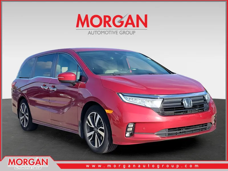 2022 Honda Odyssey Touring in Radiant Red Metallic II — front three-quarter view