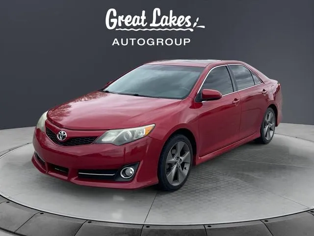 2012 Toyota CAMRY SE in Barcelona Red Metallic — front three-quarter view
