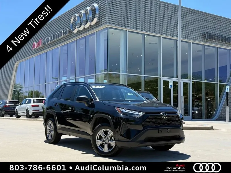 2025 Toyota RAV4 Hybrid LE in Midnight Black Metallic — front three-quarter view