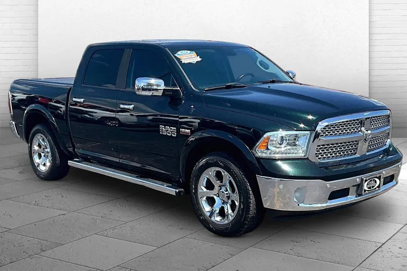 2016 RAM 1500 Laramie in Black Forest Green Pearlcoat — front three-quarter view