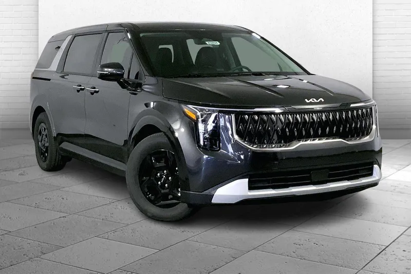 2026 Kia Carnival LXS in Panthera Metal — front three-quarter view