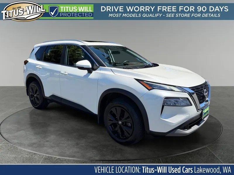2023 Nissan Rogue SV in Pearl White — front three-quarter view