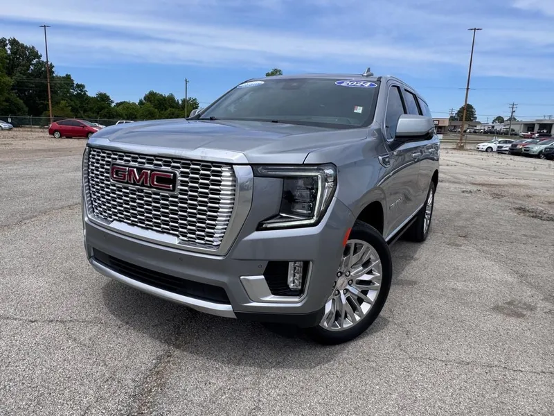 2024 GMC Yukon Denali in Sterling Metallic — front three-quarter view