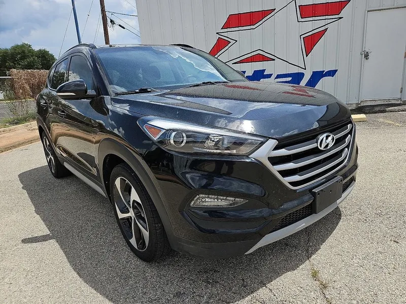 2018 Hyundai Tucson Value in Black Noir Pearl — front three-quarter view