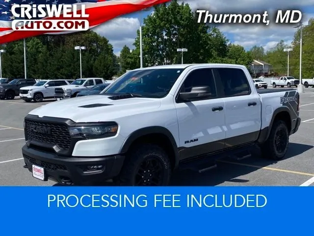 2025 RAM 1500 Rebel Crew Cab 4x4 5'7' Box in Bright White Clearcoat — front three-quarter view