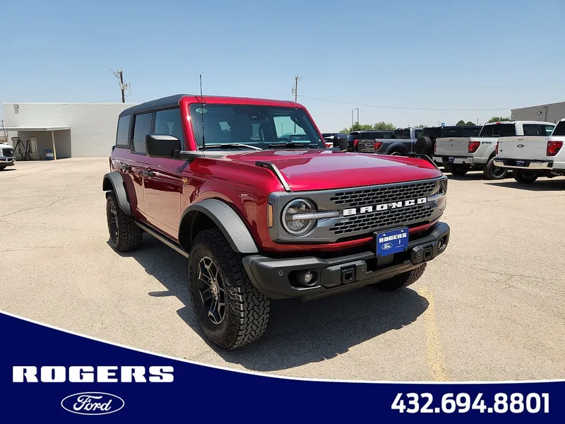 2026 Ford Bronco Badlands in Ruby Red Metallic Tinted Clearcoat — front three-quarter view