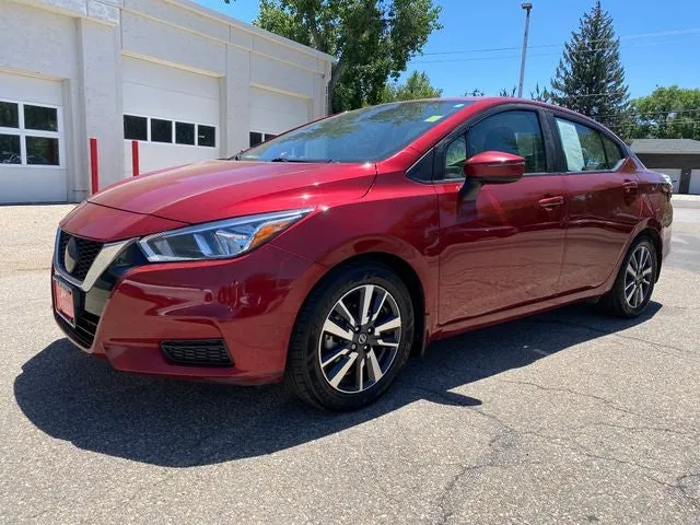 2021 Nissan Versa 1.6 SV in Scarlet Ember Pearl Metallic — front three-quarter view