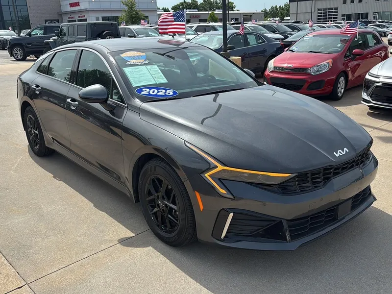2025 Kia K5 LXS in Interstellar Gray — front three-quarter view