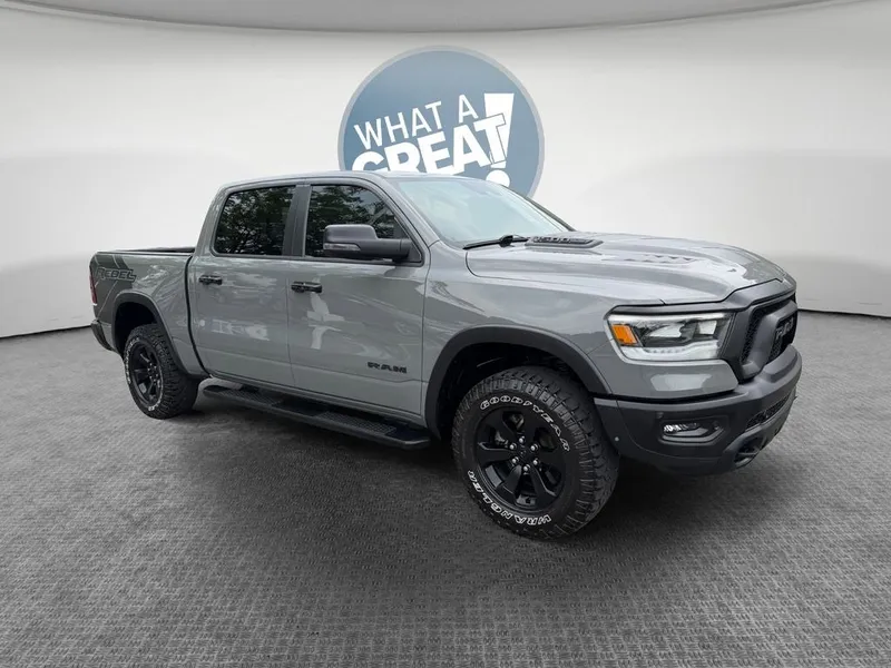 2023 RAM 1500 Rebel in Ceramic Gray Clearcoat — front three-quarter view