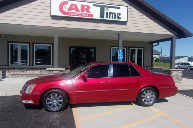 2009 Cadillac DTS w/1SB in Crystal Red Tintcoat — front three-quarter view
