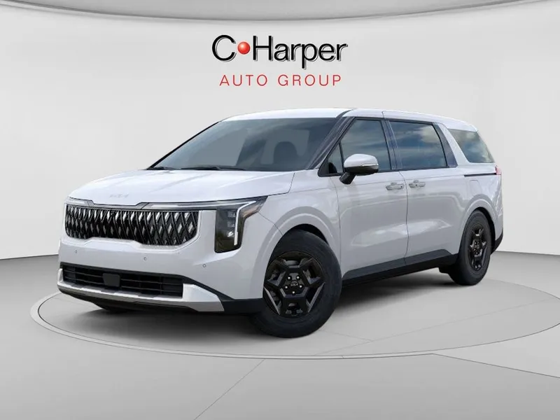 2026 Kia Carnival LX in Snow White Pearl — front three-quarter view