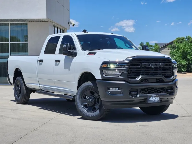 2026 RAM 2500 RAM 2500 TRADESMAN CREW CAB 4X4 8' BOX in Bright White Clear-Coat Exterior Paint — front three-quarter view