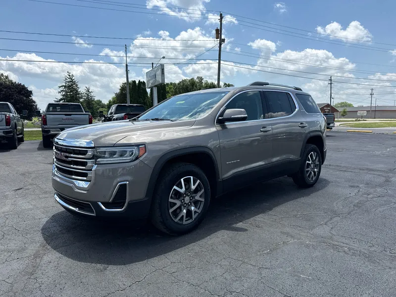 2023 GMC Acadia SLE in Light Stone Metallic — front three-quarter view