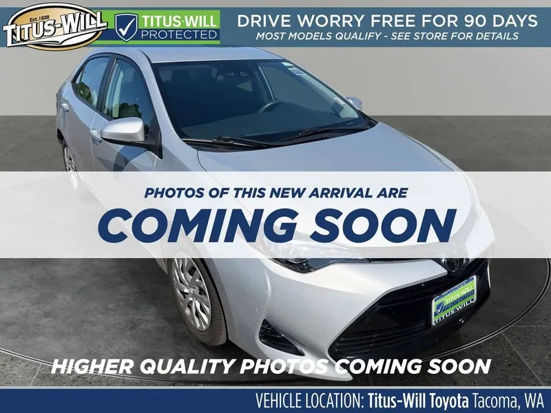 2019 Toyota Corolla LE in Classic Silver Met — front three-quarter view
