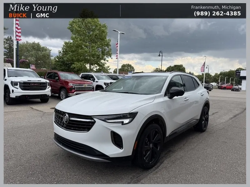 2023 Buick Envision Essence in Summit White — front three-quarter view